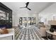 Open concept living room with fireplace, patio access, and comfortable seating arrangement at 662 Manchester Dr, Raleigh, NC 27609