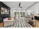 Open living room with modern fireplace, neutral palette and seamless access to the outdoor pool area at 662 Manchester Dr, Raleigh, NC 27609