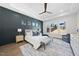 Spacious main bedroom featuring a tray ceiling, ample natural light, and neutral tones at 662 Manchester Dr, Raleigh, NC 27609