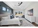 Spacious main bedroom featuring a tray ceiling, ample natural light, and neutral tones at 662 Manchester Dr, Raleigh, NC 27609