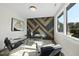 Bright office space with a unique wall design, modern desk, and comfortable seating at 662 Manchester Dr, Raleigh, NC 27609