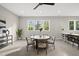 Open recreation room with natural lighting and a stylish dining table and bar at 662 Manchester Dr, Raleigh, NC 27609