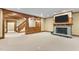 Open basement featuring a fireplace, wood accents, and ample space for entertainment at 3105 Cone Manor Ln, Raleigh, NC 27613