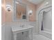 Classic bathroom with white tile, pedestal sink, and a vintage-style shower with lace curtain at 3105 Cone Manor Ln, Raleigh, NC 27613
