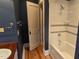 Modern bathroom with a tub and shower featuring elegant tiling and fixtures at 3105 Cone Manor Ln, Raleigh, NC 27613