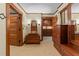 Elegant bathroom with a wood vanity, mosaic tile flooring, and wooden doors at 3105 Cone Manor Ln, Raleigh, NC 27613