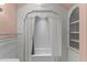 Charming bathroom showcasing a curtained tub/shower, white tiling, and built in shelving at 3105 Cone Manor Ln, Raleigh, NC 27613