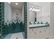Well-lit bathroom with a glass-enclosed shower and charming vanity with green accents at 3105 Cone Manor Ln, Raleigh, NC 27613