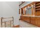 Elegant bathroom features custom wood cabinetry, granite counters, and a heated towel rack at 3105 Cone Manor Ln, Raleigh, NC 27613