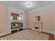Inviting bedroom featuring a decorative fireplace, seating, and classic window treatments at 3105 Cone Manor Ln, Raleigh, NC 27613