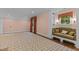 Spacious bedroom with built-in couch, windows, and patterned carpet at 3105 Cone Manor Ln, Raleigh, NC 27613
