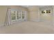 Bright bedroom with large windows and neutral colors, providing a welcoming atmosphere at 3105 Cone Manor Ln, Raleigh, NC 27613