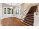 Elegant foyer with a staircase and patterned carpet, creating a sophisticated and welcoming entry at 3105 Cone Manor Ln, Raleigh, NC 27613