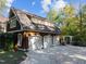This three car garage is set back from the property and has beautiful stone work at 3105 Cone Manor Ln, Raleigh, NC 27613