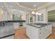 Bright kitchen featuring a large island, stainless steel appliances, and ample natural light at 3105 Cone Manor Ln, Raleigh, NC 27613