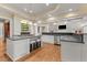 Gourmet kitchen featuring a large island, stainless steel appliances, and custom cabinetry at 3105 Cone Manor Ln, Raleigh, NC 27613