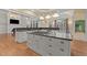 Modern kitchen island with cooktop and bar seating, complemented by custom cabinetry at 3105 Cone Manor Ln, Raleigh, NC 27613