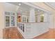 Open-concept living area featuring hardwood floors, built-in shelving and cabinets at 3105 Cone Manor Ln, Raleigh, NC 27613