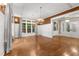 Formal dining room featuring hardwood floors, wainscoting, and elegant lighting fixtures at 3105 Cone Manor Ln, Raleigh, NC 27613