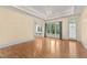 Spacious living room boasts hardwood floors, recessed lighting, and large windows offering ample natural light at 3105 Cone Manor Ln, Raleigh, NC 27613