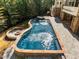 Gorgeous in-ground pool with attached spa, and outdoor fire pit offering a luxurious backyard retreat at 3105 Cone Manor Ln, Raleigh, NC 27613