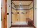 Custom tiled shower with glass door and a mosaic tile floor at 3105 Cone Manor Ln, Raleigh, NC 27613
