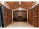 Beautiful wine cellar with brick ceiling and wood racking for ample storage at 3105 Cone Manor Ln, Raleigh, NC 27613