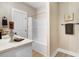 Clean bathroom with a tub/shower combo, white cabinets, and neutral decor for a tranquil experience at 9314 Turkey Way, Middlesex, NC 27557