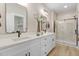 Elegant bathroom with double vanities, granite countertops, and a walk-in shower with tiled walls at 9314 Turkey Way, Middlesex, NC 27557
