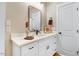 Well-lit bathroom with white cabinets, granite countertop, and a modern mirror for a refreshing ambiance at 9314 Turkey Way, Middlesex, NC 27557