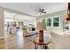 Open-concept living room showcases hardwood floors, large windows, and seamless flow into the kitchen and dining areas at 9314 Turkey Way, Middlesex, NC 27557