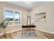 Inviting office space with a large window, wood floors, and beach themed artwork at 9314 Turkey Way, Middlesex, NC 27557