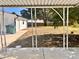 View of the home's backyard and patio area from under a covered porch at 1011 Lemon Dr, Durham, NC 27705