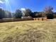 Large backyard space featuring grass lawn area and newly installed wooden fence at 1011 Lemon Dr, Durham, NC 27705