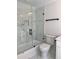 Modern bathroom featuring a glass enclosed shower with sleek black hardware and white marble tile at 1011 Lemon Dr, Durham, NC 27705