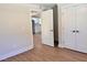 Entryway featuring hardwood floors and view into a modern, well-lit kitchen at 1011 Lemon Dr, Durham, NC 27705