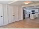 Open entryway featuring hardwood floors and views of a bright, modern kitchen at 1011 Lemon Dr, Durham, NC 27705