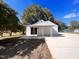Exterior of the home showing the driveway, backyard and carport addition at 1011 Lemon Dr, Durham, NC 27705
