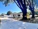 Charming white home with a newly poured concrete driveway and beautiful trees at 1011 Lemon Dr, Durham, NC 27705