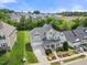 Beautiful home with well-manicured lawn, mature trees, and a charming front porch, nestled in a Gathering-friendly neighborhood at 2024 Stanchion St, Haw River, NC 27258