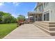 Spacious wooden deck overlooking a well-manicured backyard, offering a serene and inviting outdoor living space at 2024 Stanchion St, Haw River, NC 27258
