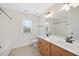 Bright bathroom features a dual sink vanity, large mirror, and shower-tub combination at 2024 Stanchion St, Haw River, NC 27258
