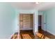 Bedroom closet with hardwood floors and white-painted organizers that fill the interior at 2024 Stanchion St, Haw River, NC 27258