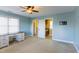 Bedroom features light blue walls, ceiling fan and walk in closet at 2024 Stanchion St, Haw River, NC 27258