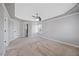 Spacious bedroom featuring a ceiling fan, carpeted floors, and natural light from a window at 2024 Stanchion St, Haw River, NC 27258
