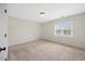 Neutral bedroom featuring carpet and a window providing natural light at 2024 Stanchion St, Haw River, NC 27258