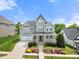 Charming two-story home features a welcoming front porch and well-manicured landscaping at 2024 Stanchion St, Haw River, NC 27258
