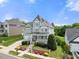 Charming two-story home features a welcoming front porch and well-manicured landscaping at 2024 Stanchion St, Haw River, NC 27258