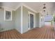 Spacious front porch features a wood deck and a light blue ceiling at 2024 Stanchion St, Haw River, NC 27258
