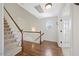 Open hallway with staircase and hardwood floors leading to the next level at 2024 Stanchion St, Haw River, NC 27258